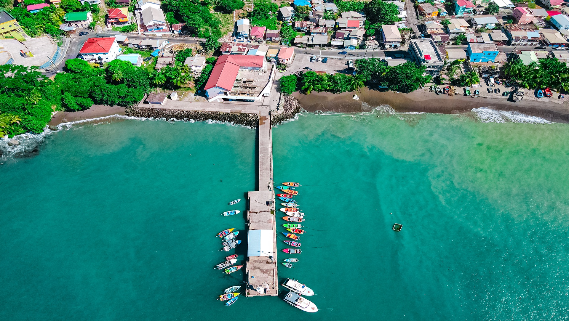 Aerial view of Gouyave fishing pier and colourful boats